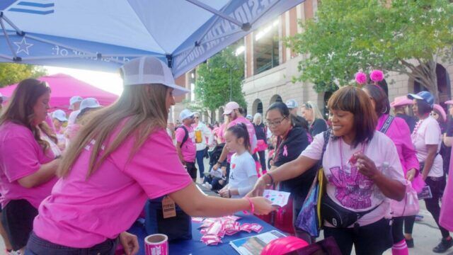 Kpost Roofing Booth handing out freebies
